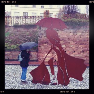 Umbrella Woman and Metal Sculpture in Bitche/France
